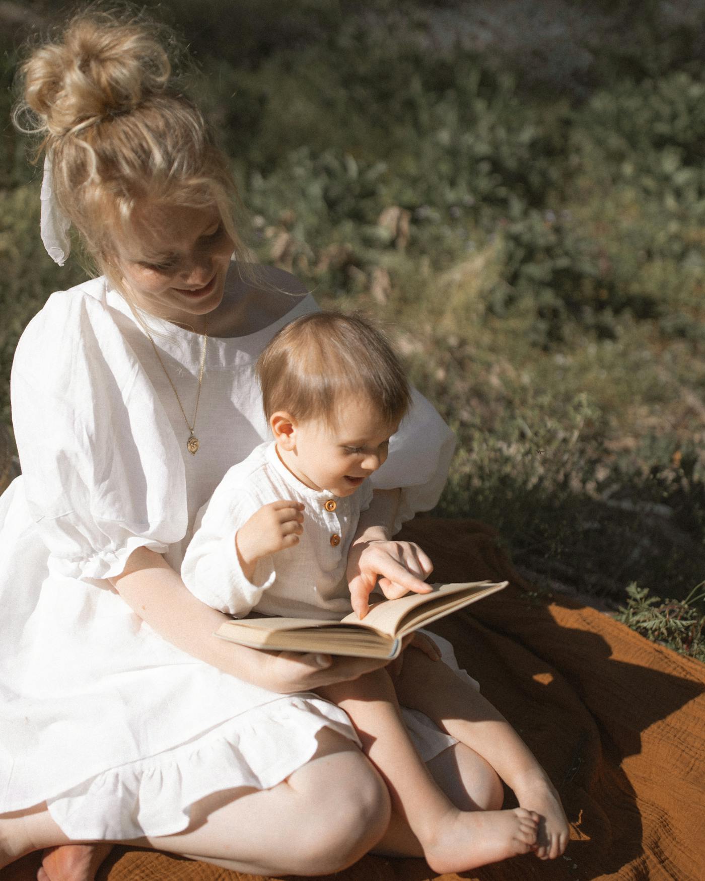 Young child enjoying a calm activity in a warm, sunlit room